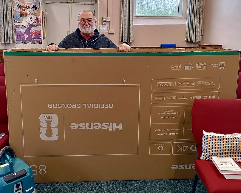 Pastor Tony with the biggest cardboard box